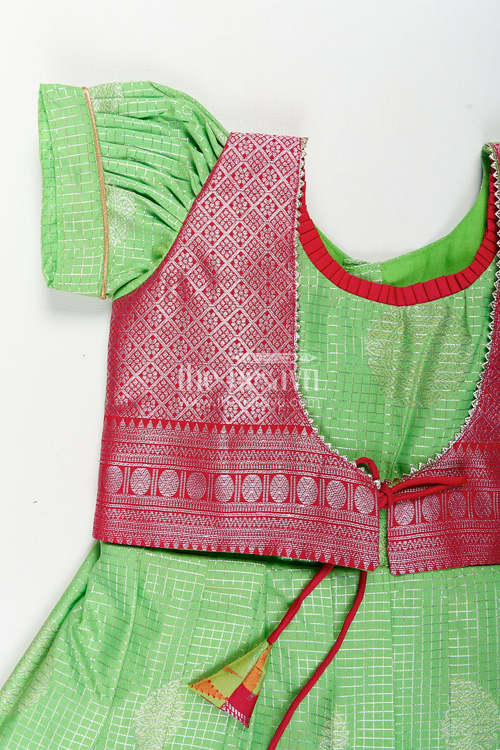 Girls Silky Long Frock in Semi Kanchivaram with Rich Pink Zari Pleats and Green Patterned Bodice