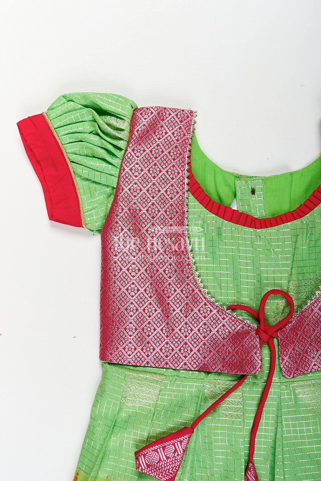 Girls Silky Long Frock in Semi Kanchivaram with Rich Pink Zari Pleats and Green Patterned Bodice