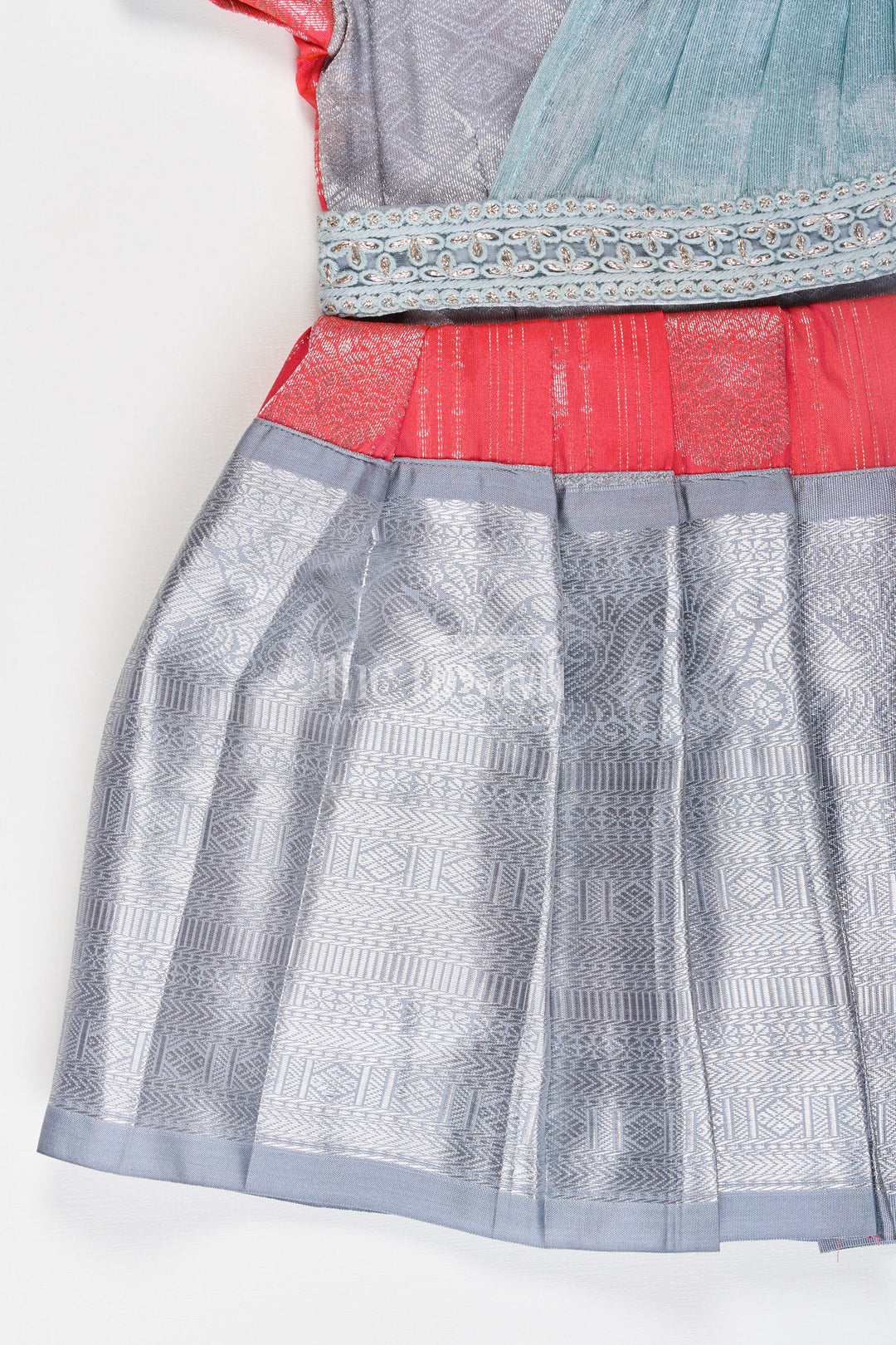 Girls Pattu Frock Model in Blue Semi Kanchivaram Silk with Red Accents and Lace Embellished Dupatta