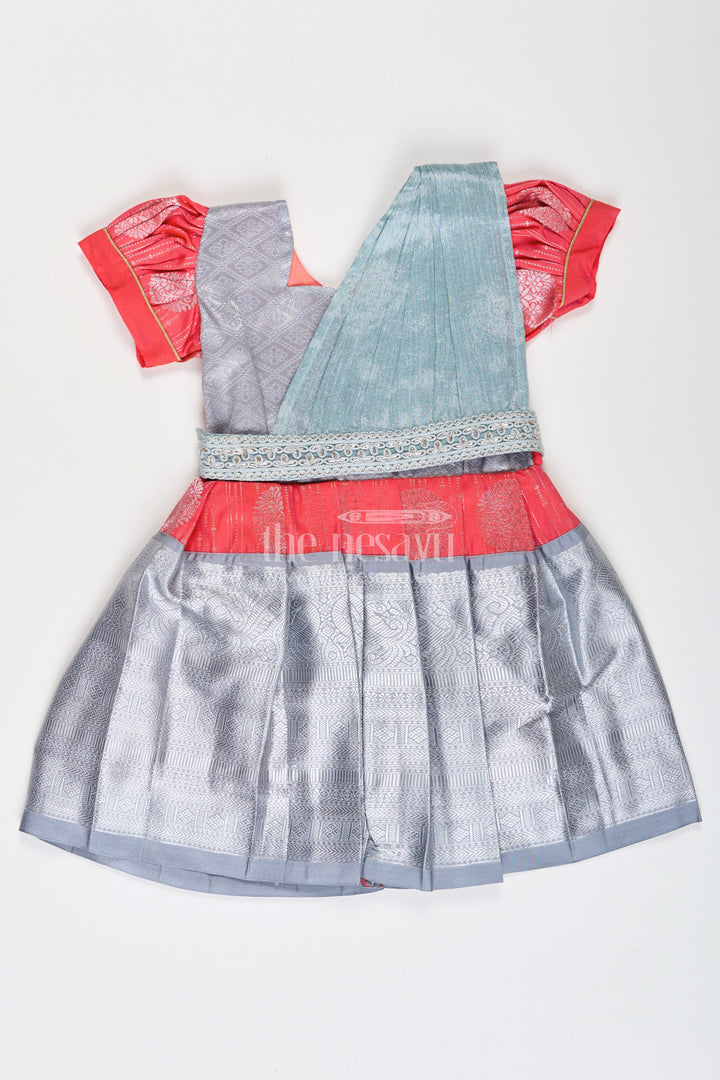 Girls Pattu Frock Model in Blue Semi Kanchivaram Silk with Red Accents and Lace Embellished Dupatta