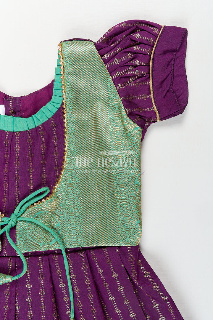 Girls Kanchivaram Long Green Frock with Puff Sleeves in Purple and Zari Woven Skirt and Overlay Detail