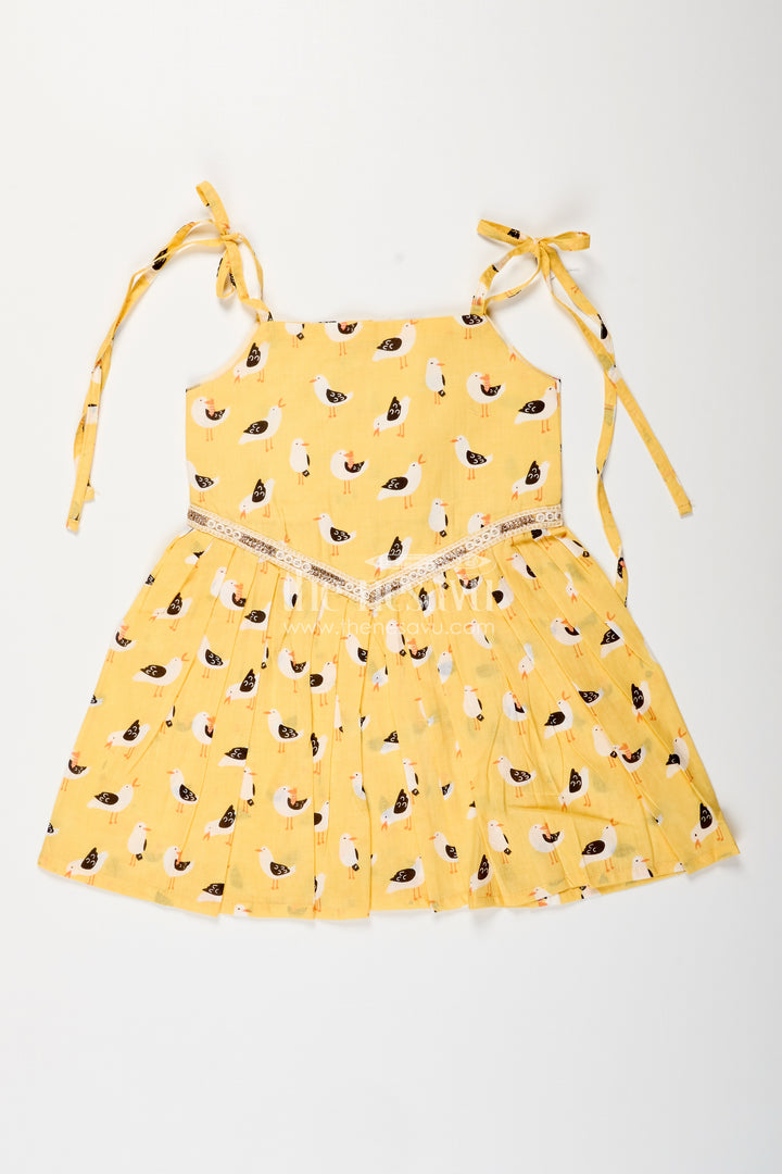 Yellow tie-up cotton frock for toddler girls with playful bird print