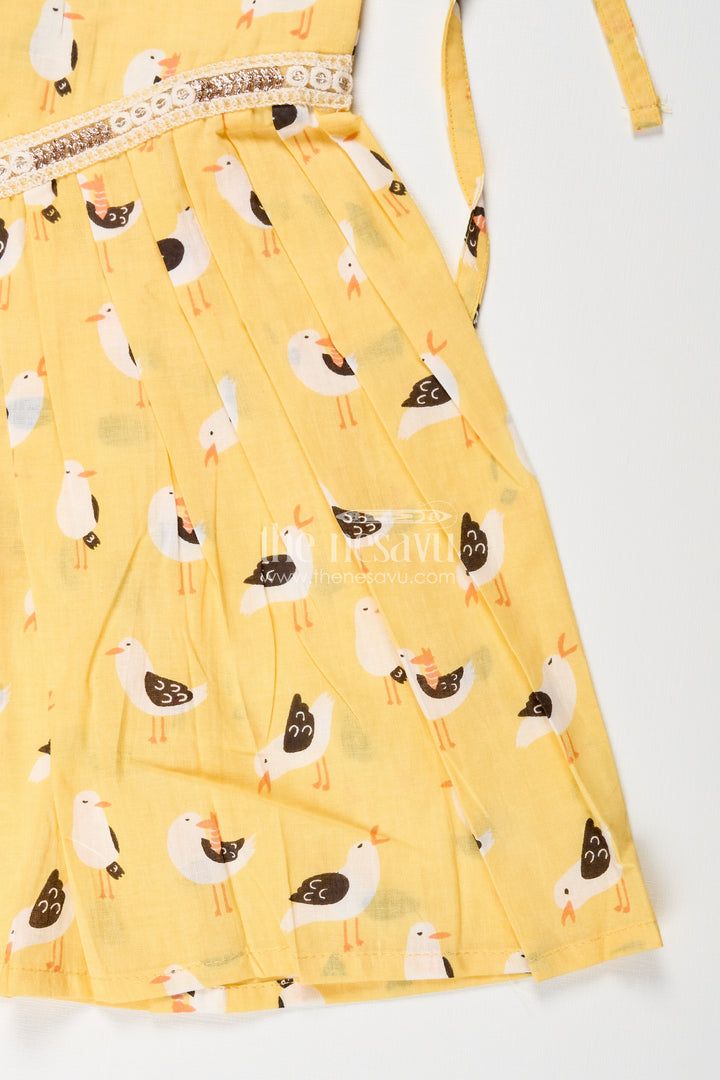 Yellow tie-up cotton frock for toddler girls with playful bird print