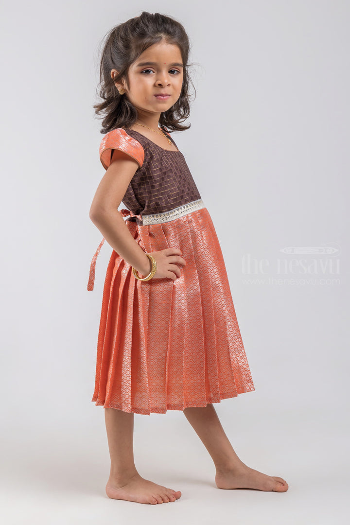 The Nesavu Silk Embroidered Frock Adorable Checked Pattern Dark Brown Yoke and Knife Pleated Zari With Geometrical Designer Orange Silk Frock for Girls psr silks Nesavu