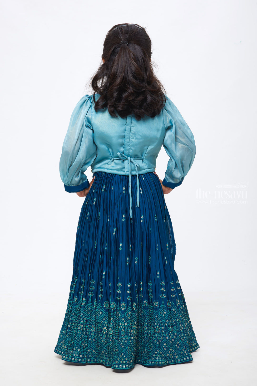 The Nesavu Girls Lehenga Choli Azure Allure: Girls Teal Blue Pleated Gown with Crystal-Studded Blouse Nesavu Captivating Charm for Festive Moments | Girls Lehenga Choli with Dupatta | The Nesavu