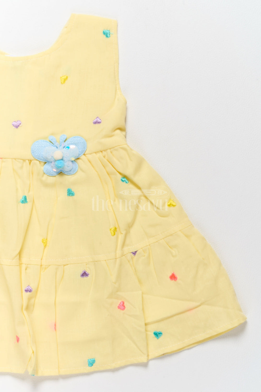 The Nesavu Baby Cotton Frocks Baby Cotton Yellow Short Frock with Colorful Heart Embroidery and Flower Detail Nesavu Nesavu Baby Cotton Yellow Short Frock Colorful Heart Embroidery Flower Detail