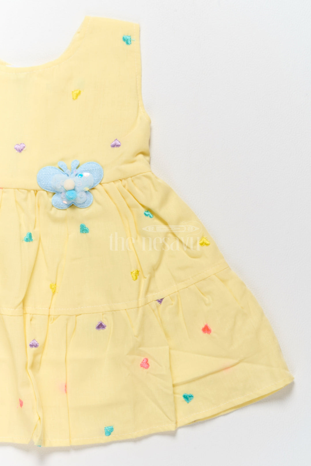 The Nesavu Baby Cotton Frocks Baby Cotton Yellow Short Frock with Colorful Heart Embroidery and Flower Detail Nesavu Nesavu Baby Cotton Yellow Short Frock Colorful Heart Embroidery Flower Detail