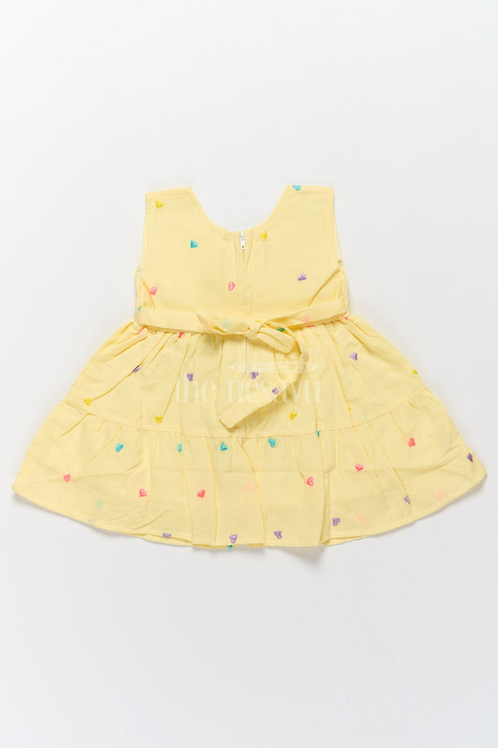 The Nesavu Baby Cotton Frocks Baby Cotton Yellow Short Frock with Colorful Heart Embroidery and Flower Detail Nesavu Nesavu Baby Cotton Yellow Short Frock Colorful Heart Embroidery Flower Detail