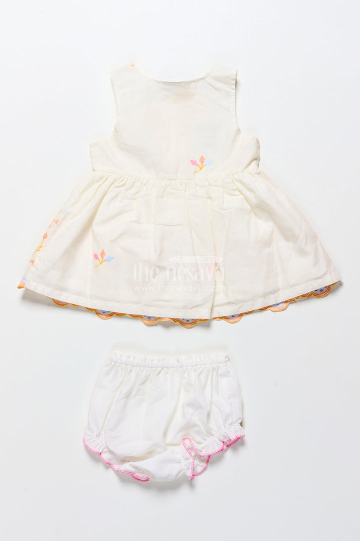 The Nesavu Baby Frocks Baby Frock with Rainbow Leaf Embroidery and Floral Patch Nesavu Nesavu cream baby frock with rainbow embroidery and floral detail