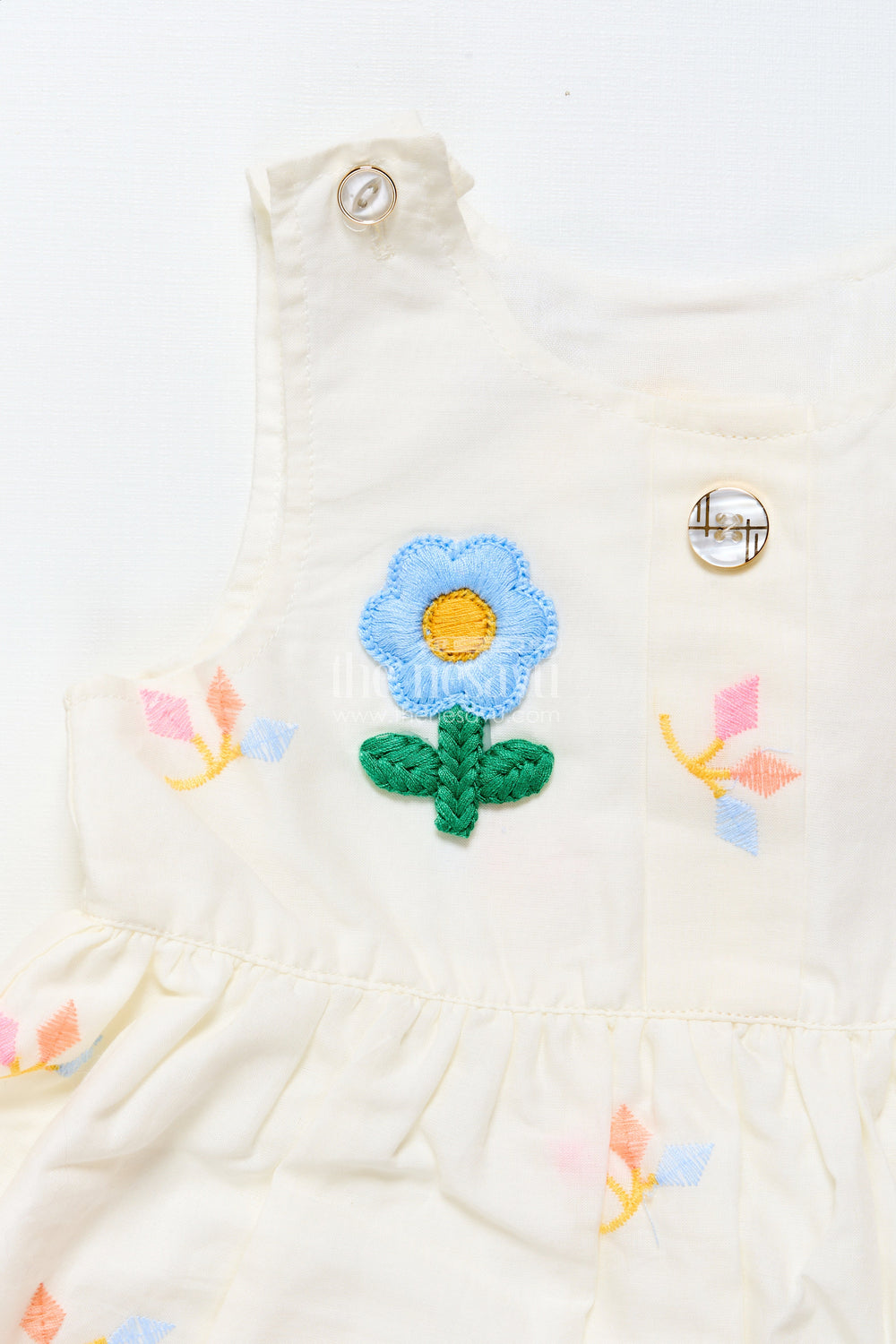 The Nesavu Baby Frocks Baby Frock with Rainbow Leaf Embroidery and Floral Patch Nesavu Nesavu cream baby frock with rainbow embroidery and floral detail