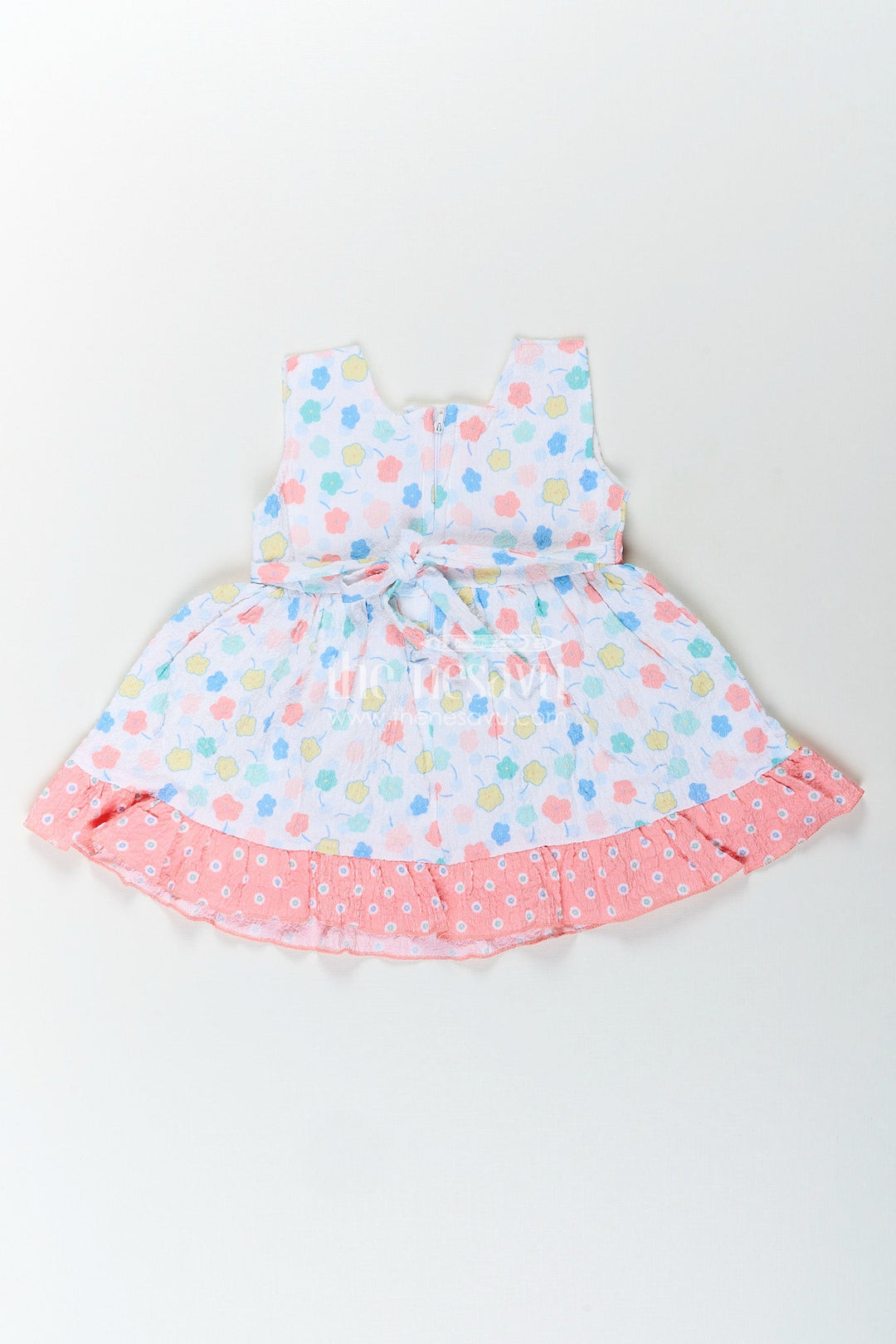The Nesavu Baby Cotton Frocks Baby girl cotton frock with pastel floral print and ruffle hem Nesavu Nesavu baby girl frock with pastel floral print and ruffled hem in soft sheer cotton