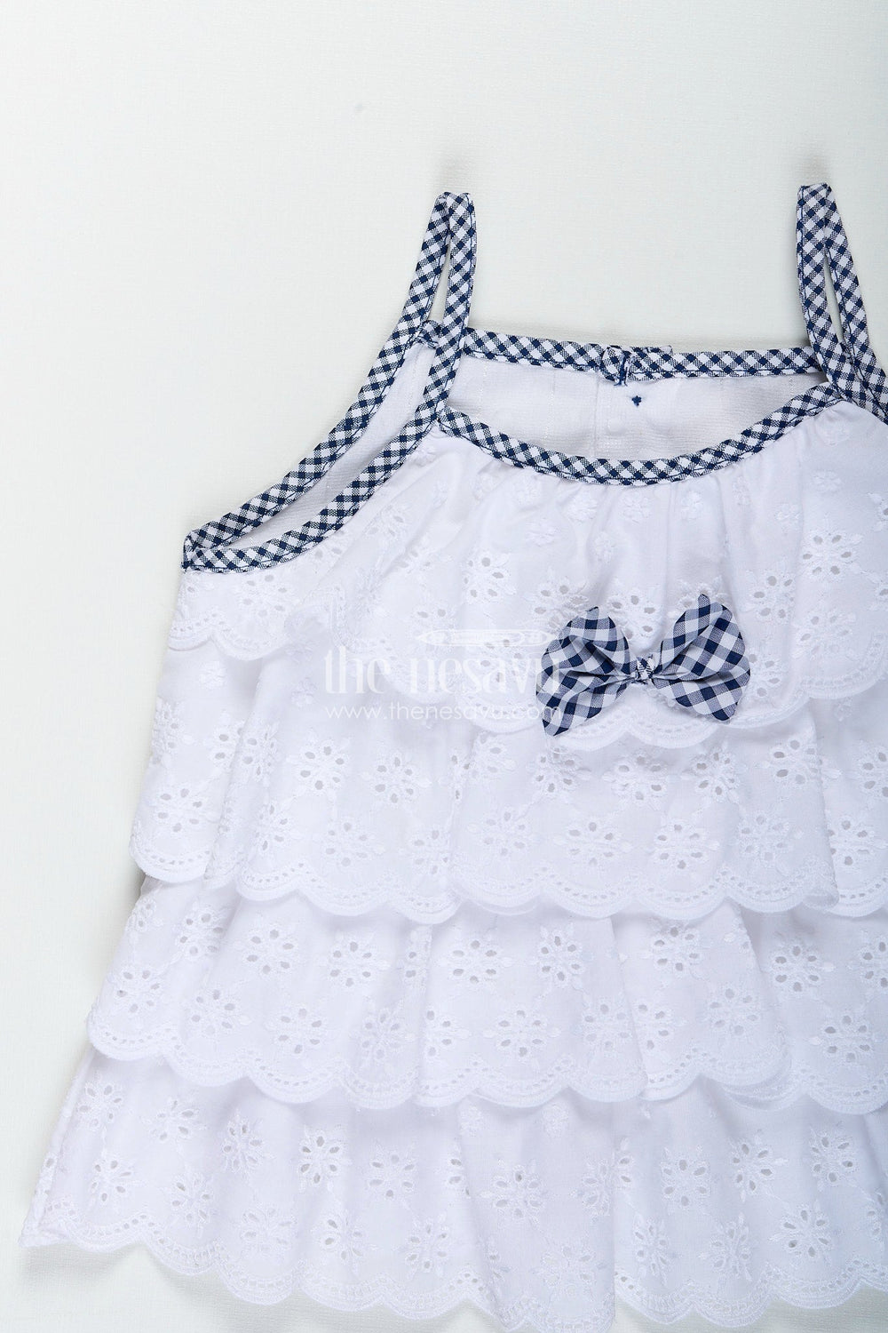 The Nesavu Baby Frocks Baby girl frock with navy gingham shorts and bow detailing Nesavu Nesavu white hakoba baby frock with navy checked bloomers