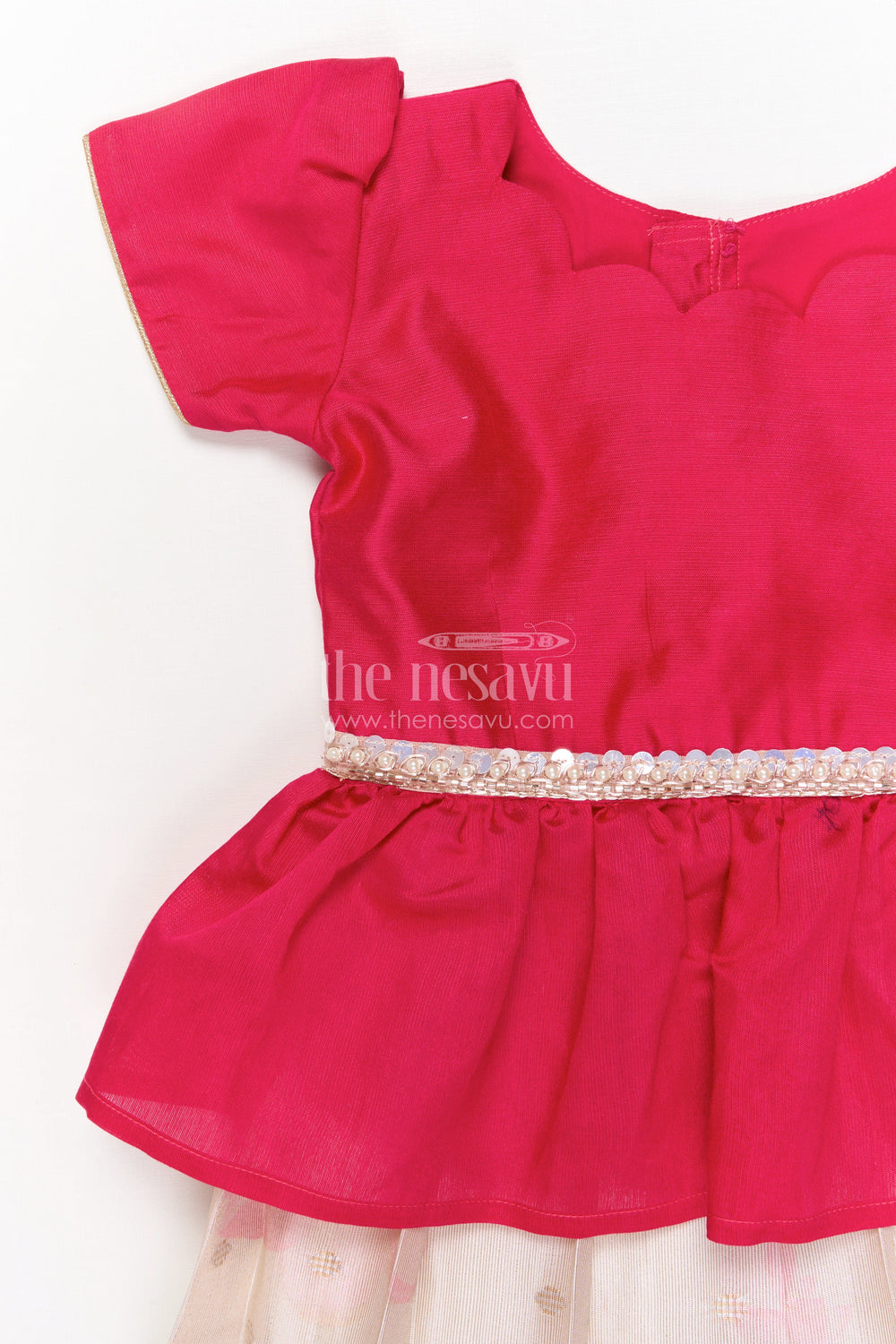 The Nesavu Pattu Pavadai Baby Girl Pattu Pavadai with Floral Print Skirt for Festive Moments Nesavu Nesavu baby girl pattu pavadai with floral tissue print skirt and semi raw silk blouse for festive occasions