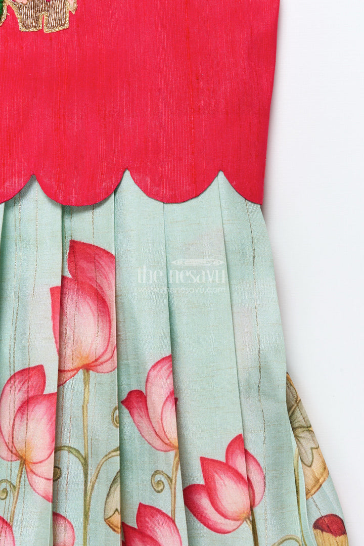 The Nesavu Pattu Pavadai Baby Girl Pattu Pavadai with Floral Skirt and Elephant-embroidered Blouse Nesavu Nesavu baby girl pattu pavadai with lotus print skirt and embroidered elephant blouse