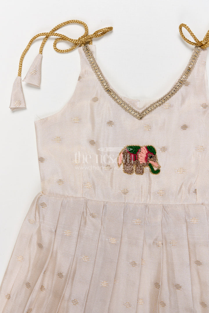 The Nesavu Tie-up Frock Baby Girl Tie-up Frock for Ethnic Functions and Naming Ceremonies Nesavu Nesavu baby girl ethnic frock with elephant embroidery and Banaras art silk for festive rituals
