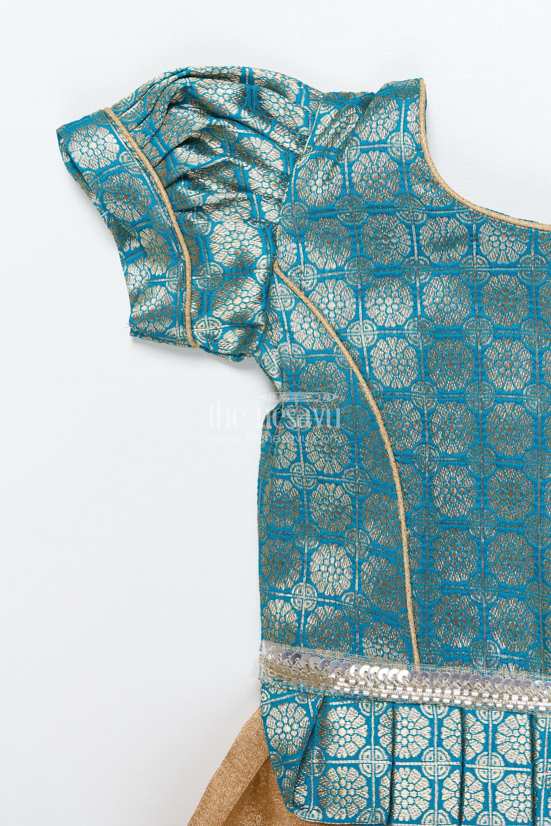 The Nesavu Pattu Pavadai Baby Girl Traditional Pattu Pavadai in Tissue Silk with Zari Finish Nesavu Nesavu baby girl golden tissue silk pattu pavadai with semi Banaras blouse for festive wear