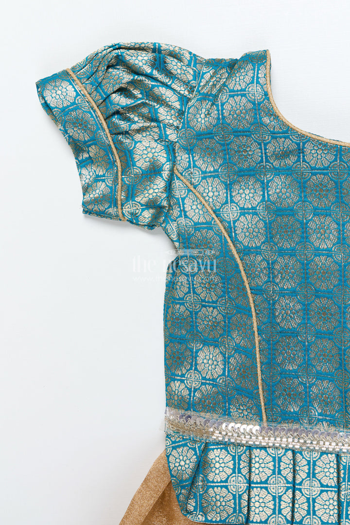 The Nesavu Pattu Pavadai Baby Girl Traditional Pattu Pavadai in Tissue Silk with Zari Finish Nesavu Nesavu baby girl golden tissue silk pattu pavadai with semi Banaras blouse for festive wear