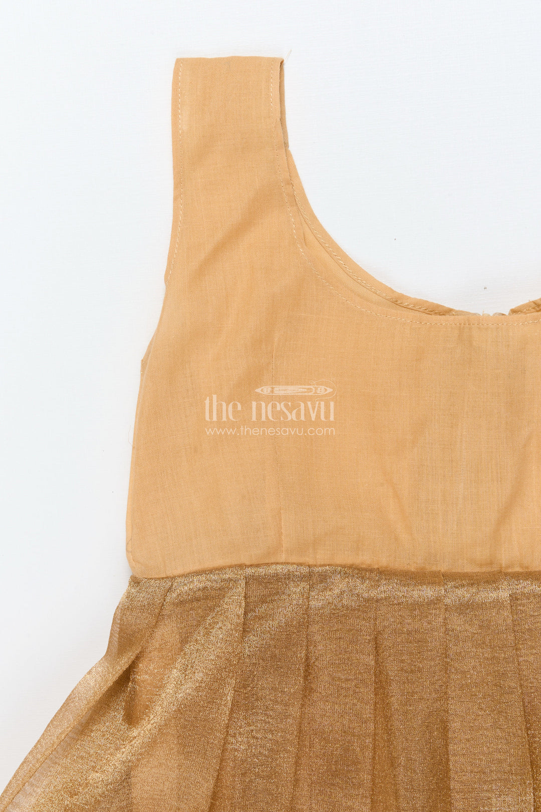 The Nesavu Pattu Pavadai Baby Girl Traditional Pattu Pavadai in Tissue Silk with Zari Finish Nesavu Nesavu baby girl golden tissue silk pattu pavadai with semi Banaras blouse for festive wear