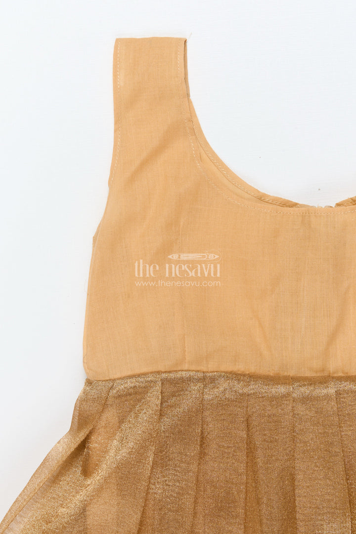 The Nesavu Pattu Pavadai Baby Girl Traditional Pattu Pavadai in Tissue Silk with Zari Finish Nesavu Nesavu baby girl golden tissue silk pattu pavadai with semi Banaras blouse for festive wear