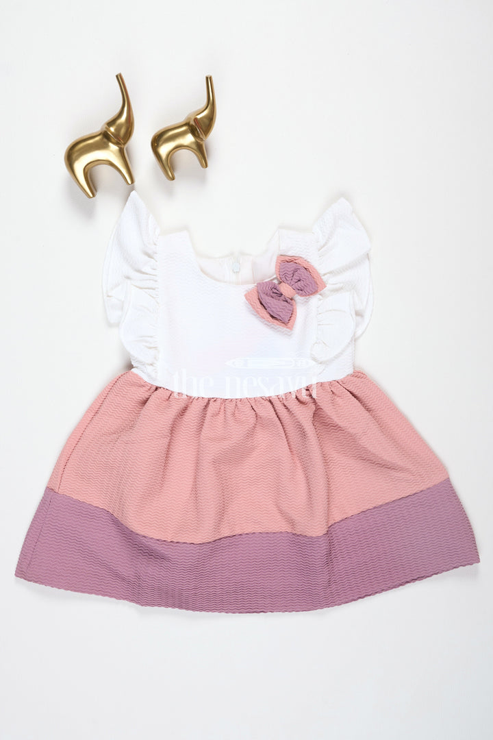 The Nesavu Baby Fancy Frock Baby Girls Beige Cotton White Frock with Color Block Design and Bow Accent for Family Gatherings Nesavu Nesavu Baby Girls Beige Cotton Frock Bow Detail Color Block Design Family Outings Playdates