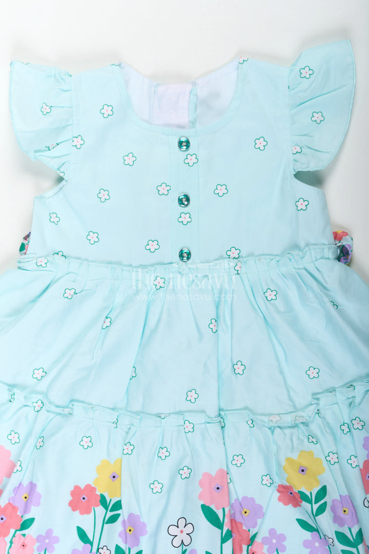 The Nesavu Baby Cotton Frocks Baby Girls Cotton Eid Frock with Pastel Green Tone and Bright Floral Border for Festive Comfort Nesavu Nesavu Baby Girls Eid Frock Cotton Colorful Floral Border Festive Green Hue