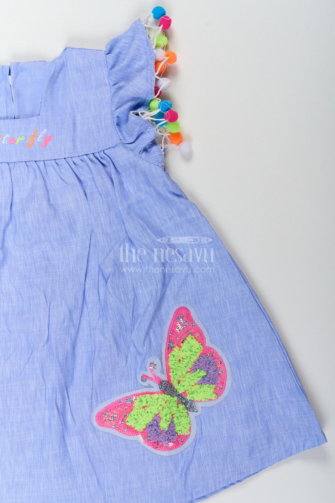 The Nesavu Baby Cotton Frocks Baby Girls Dark Blue Frock with Butterfly Patch and Pom Pom Sleeves in Cotton Blend Nesavu Nesavu Baby Girls Dark Blue Frock Cotton Blend Butterfly Patch Pom Pom Embroidery
