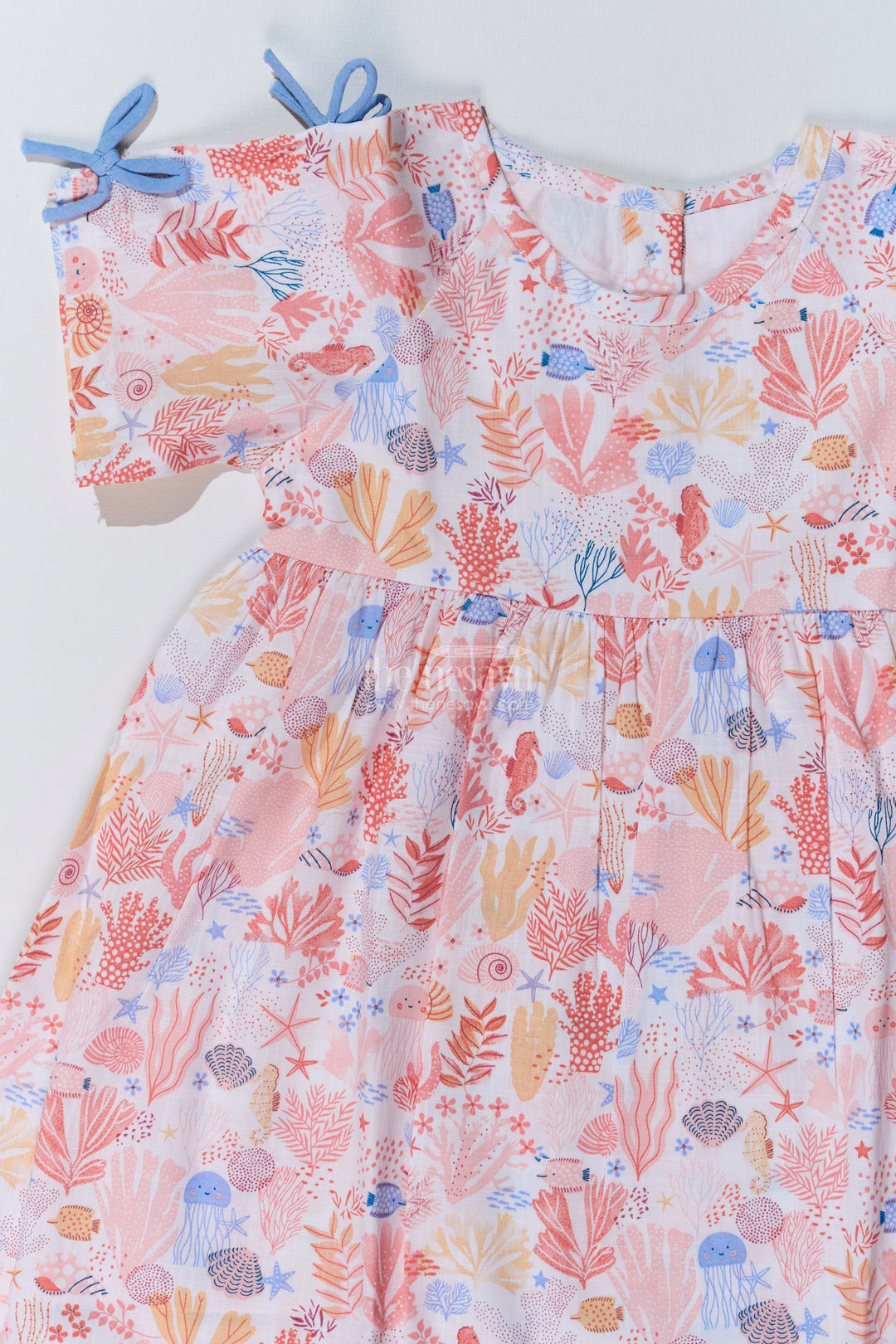 The Nesavu Baby Cotton Frocks Baby Girls Peach Frock with Ocean-Inspired Print and Tie-Up Sleeves for a Charming Look Nesavu Nesavu Baby Girls Peach Frock Ocean Print Tie-Up Sleeves Playful Outfits