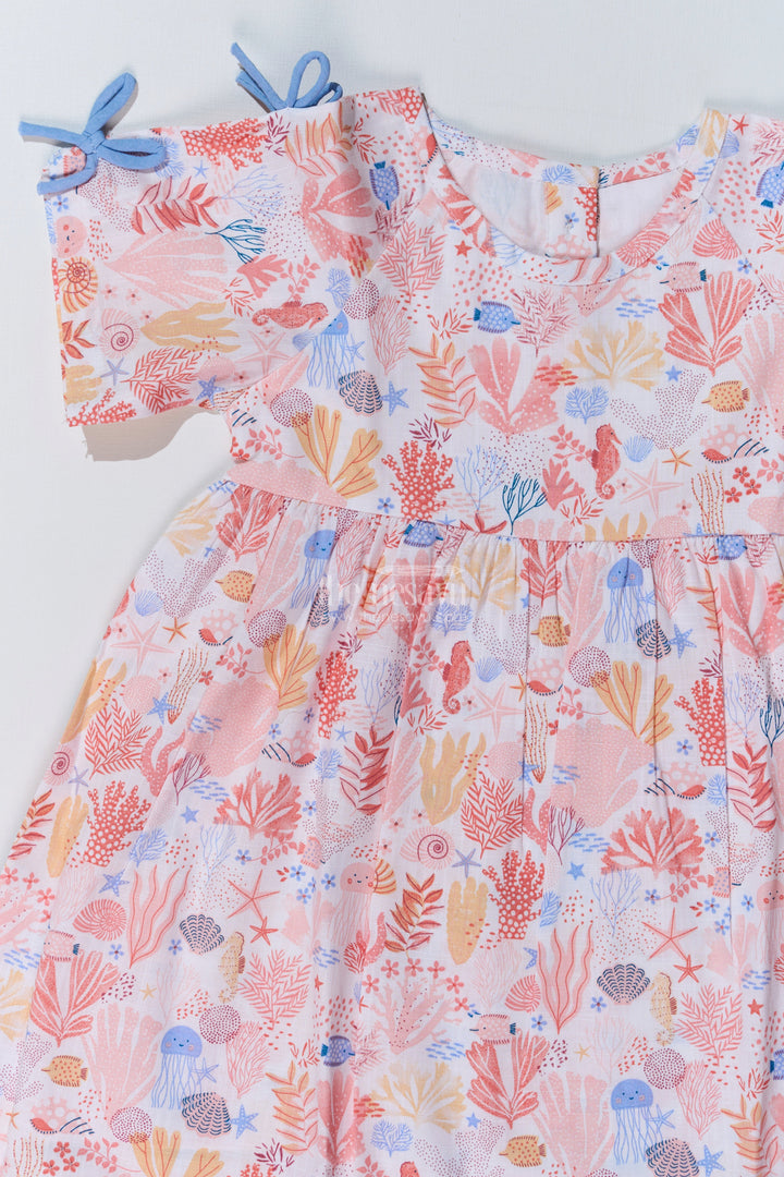 The Nesavu Baby Cotton Frocks Baby Girls Peach Frock with Ocean-Inspired Print and Tie-Up Sleeves for a Charming Look Nesavu Nesavu Baby Girls Peach Frock Ocean Print Tie-Up Sleeves Playful Outfits