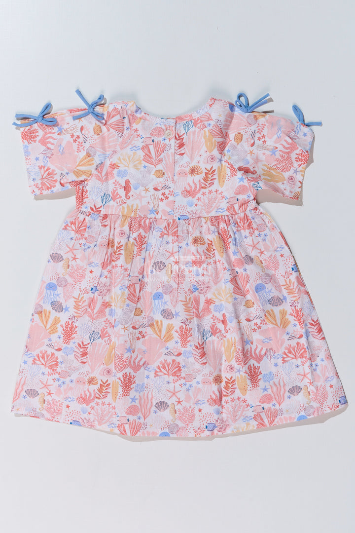 The Nesavu Baby Cotton Frocks Baby Girls Peach Frock with Ocean-Inspired Print and Tie-Up Sleeves for a Charming Look Nesavu Nesavu Baby Girls Peach Frock Ocean Print Tie-Up Sleeves Playful Outfits
