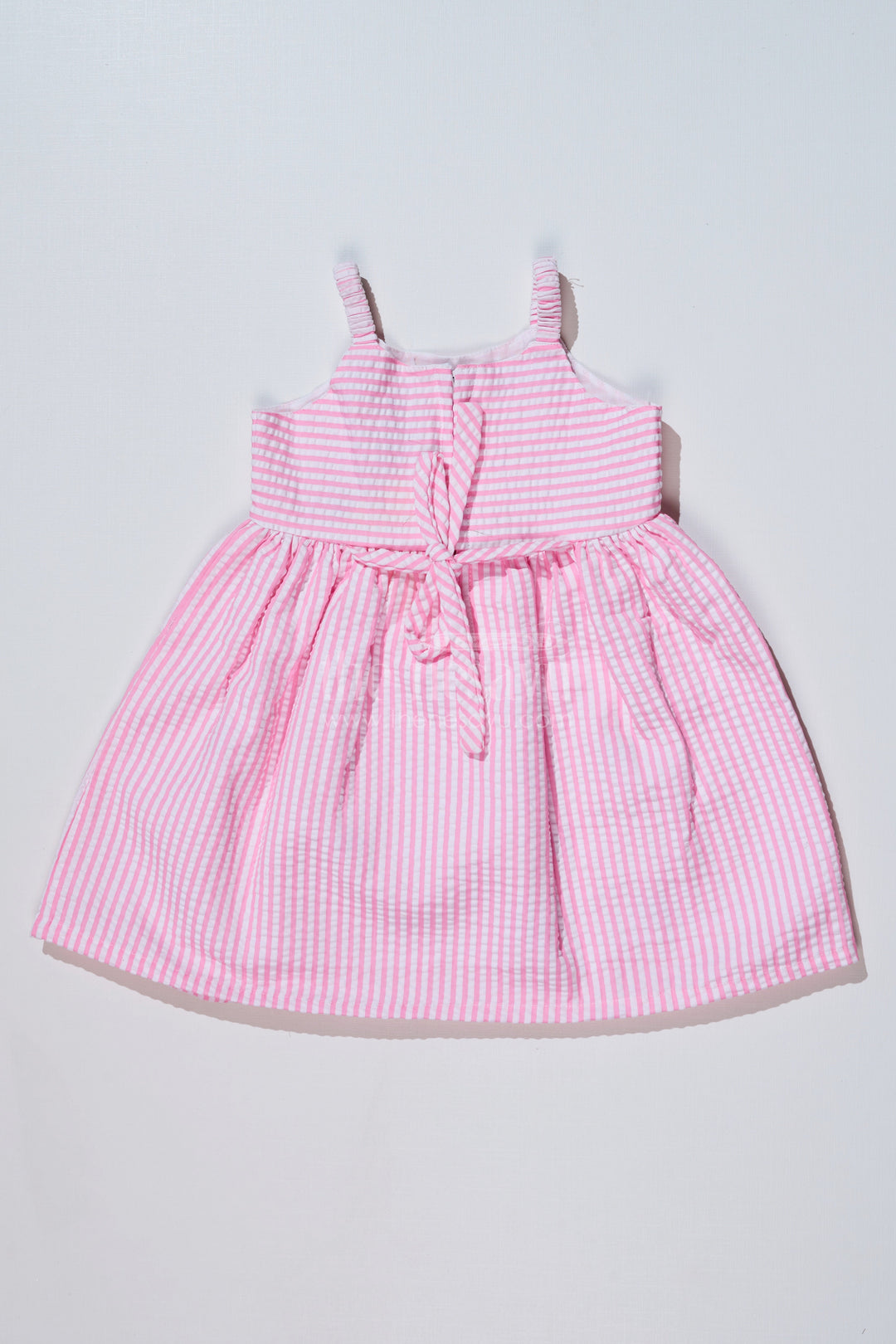 The Nesavu Baby Cotton Frocks Baby Girls Pink Cotton Frock in Seer Sucker Fabric with Floral Embroidery and Bow Accent Nesavu Nesavu Baby Girls Pink Cotton Frock Seer Sucker Fabric Floral Embroidery