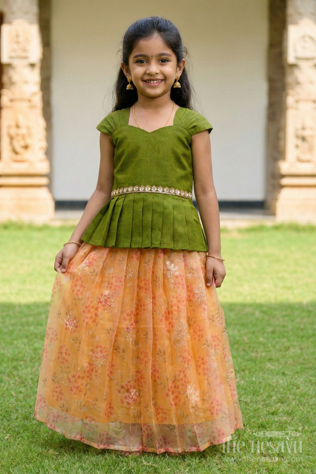 The Nesavu Pattu Pavadai Baby Pattu Pavadai with Floral Skirt for Birthdays and Outdoor Events Nesavu Nesavu floral pattu pavadai for baby girls with raw silk blouse – perfect for birthdays and summer events