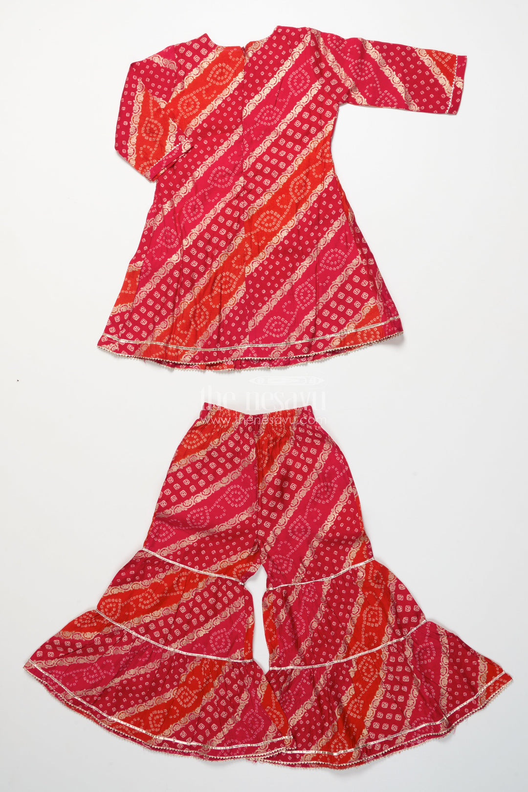 The Nesavu Girls Sharara / Plazo Set Bandhani-Inspired Festive Sharara Set with Layered Flare Nesavu Nesavu girls bandhani style festive sharara set peplum kurta layered pants