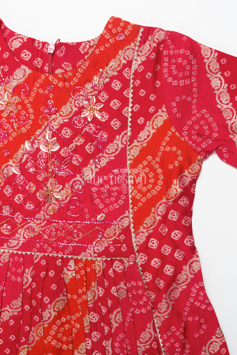 The Nesavu Girls Sharara / Plazo Set Bandhani-Inspired Festive Sharara Set with Layered Flare Nesavu Nesavu girls bandhani style festive sharara set peplum kurta layered pants