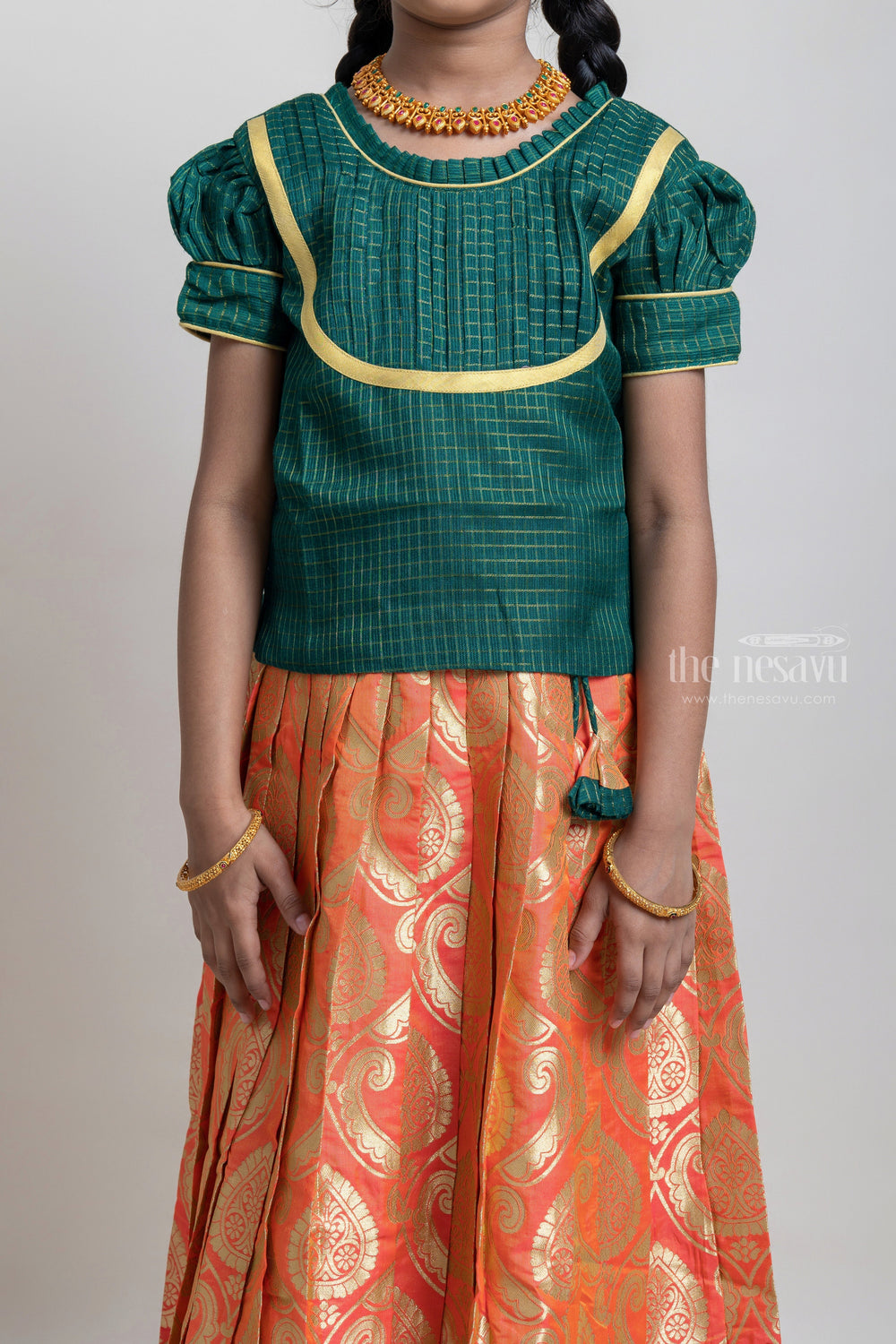 The Nesavu Pattu Pavadai Beautiful Traditional Green Semi Silk Blouse With Orange Pleated Designer Pattu Pavadai For Girls Nesavu Silk Pavada For Girls | Premium Silk Frock Onine | The Nesavu