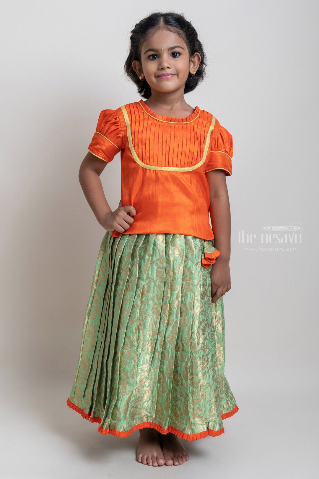 The Nesavu Pattu Pavadai Beautiful Traditional Orange Silk Blouse With Green Pleated Designer Pattu Pavadai Nesavu 14 (6M) / Green / Jacquard GPP254B-14 Silk Pavada For Girls | Premium Silk Frock Onine | The Nesavu
