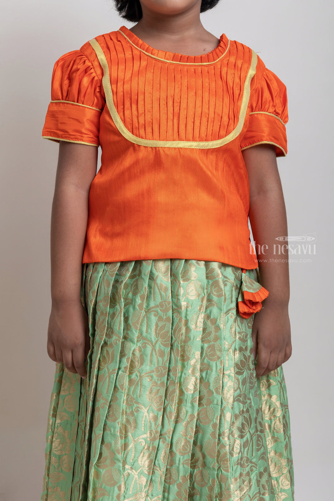 The Nesavu Pattu Pavadai Beautiful Traditional Orange Silk Blouse With Green Pleated Designer Pattu Pavadai Nesavu Silk Pavada For Girls | Premium Silk Frock Onine | The Nesavu