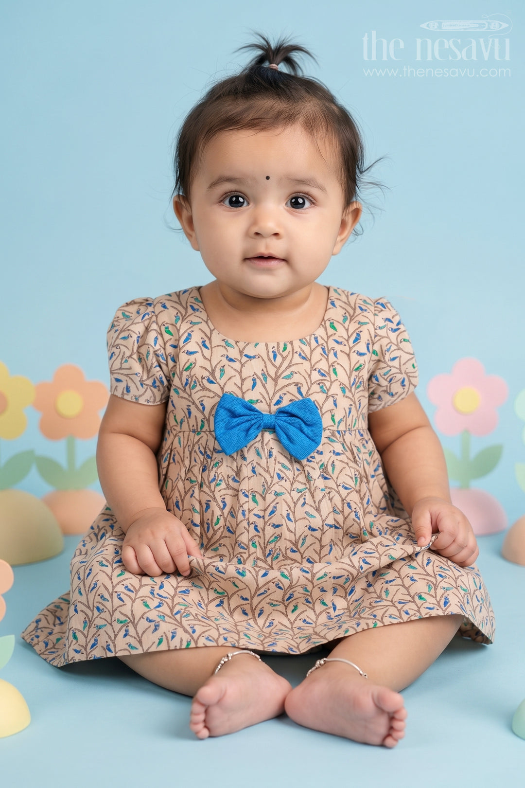 The Nesavu Baby Cotton Frocks Beige Floral Print Cotton Baby Frock for Girls with Blue Bow Accent Nesavu 10 (NB) / Beige BFJ562C-10 Beige Floral Cotton Baby Frock with Blue Bow