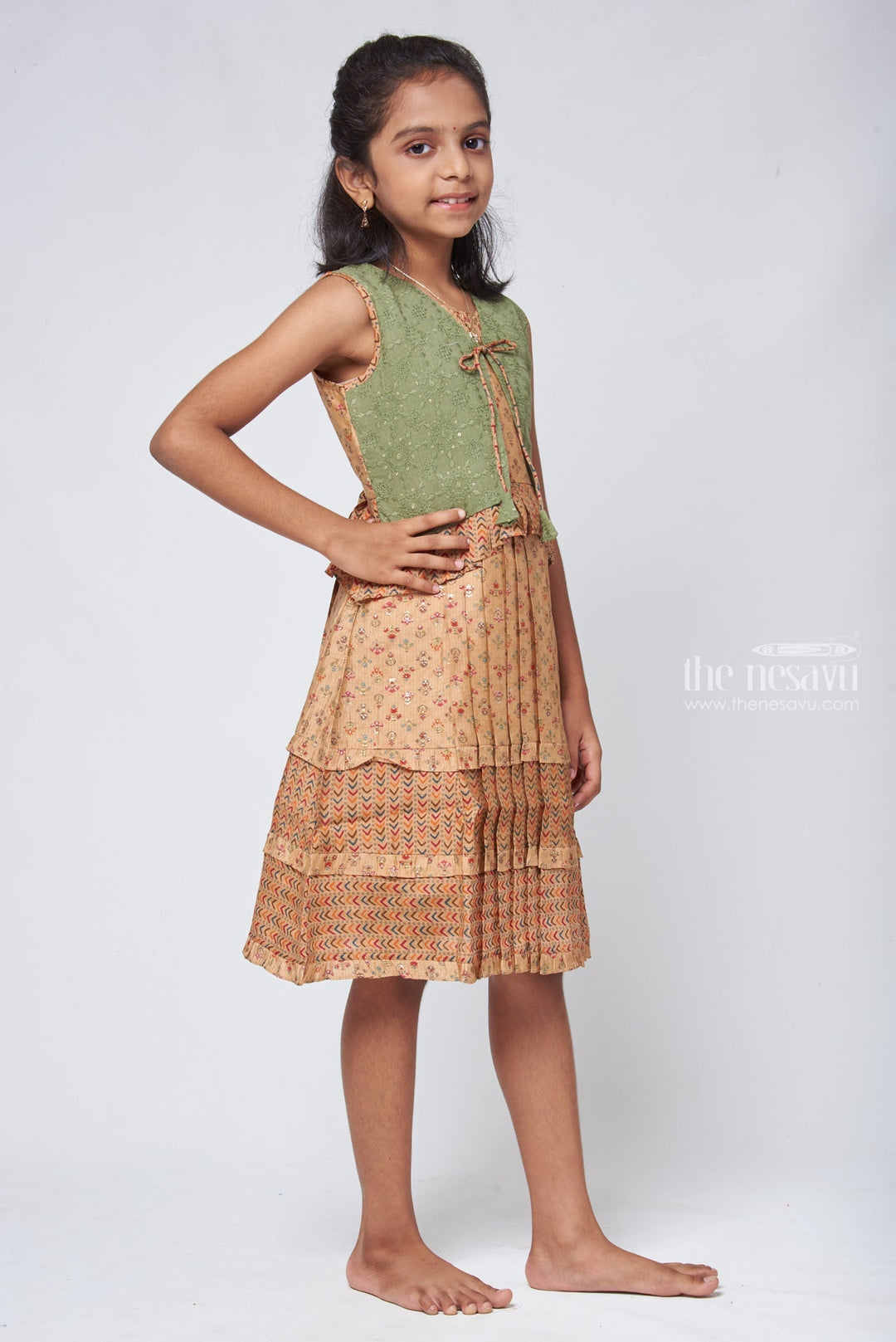 The Nesavu Girls Cotton Frock Beige Geometrical Pleated Cotton Frock with Green Overcoat - Designer Girls Attire Nesavu Cotton Frock Gown | Simple Cotton Frocks Designs | The Nesavu