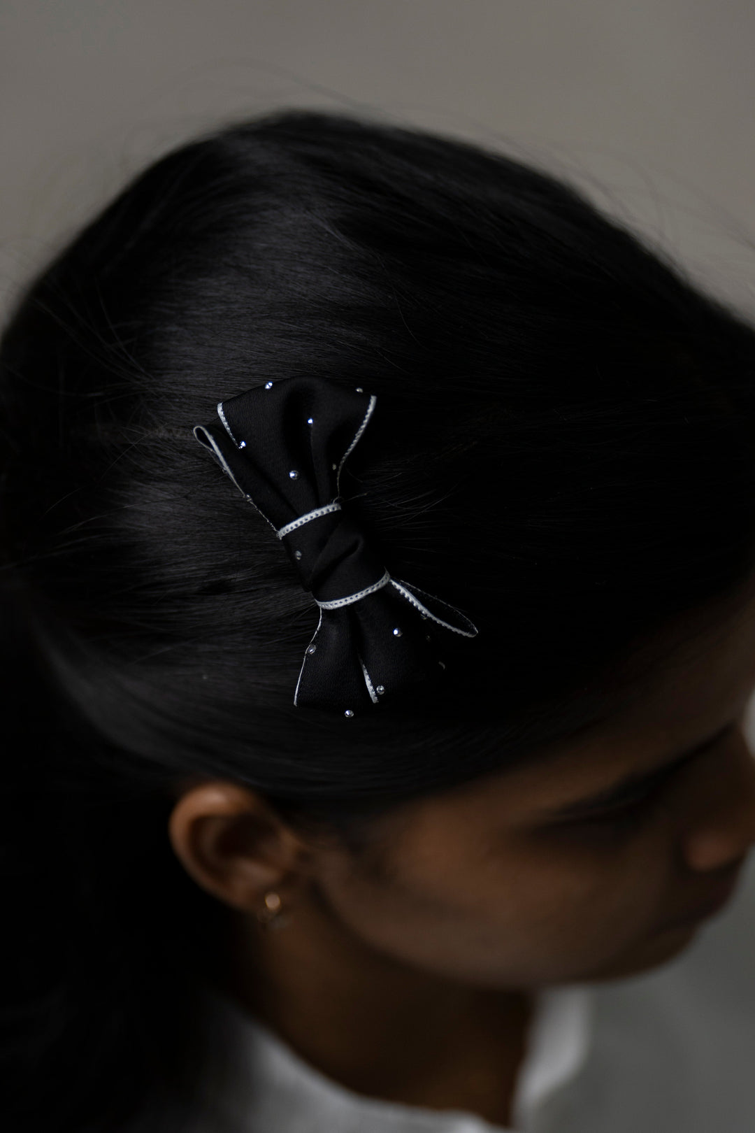 The Nesavu Hair Clip Black Satin Rhinestone Bow Hair Clip for Stylish Girls Nesavu Black JHCL72B Black bow clip for kids | Sophisticated hair clip for girls | The Nesavu