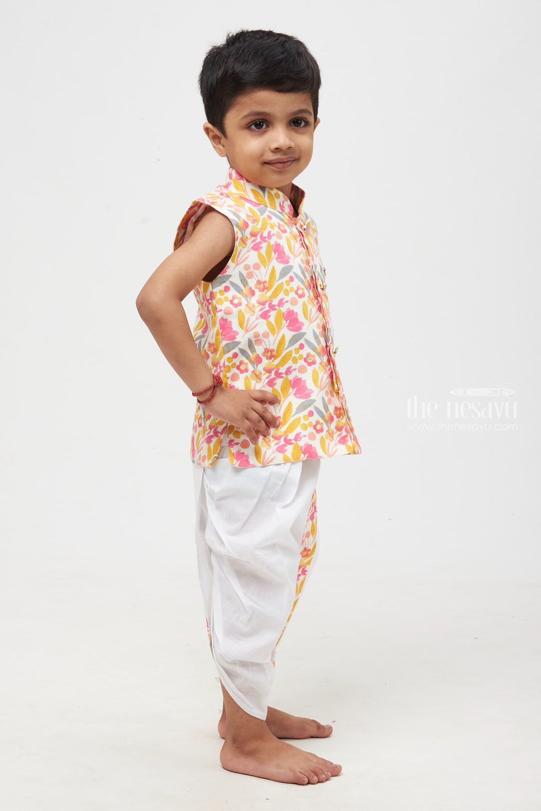 The Nesavu Boys Dothi Set Blossom Delight: Vibrant Floral Printed Kurta Shirt with White Dhoti Set for Boys Nesavu Boys Floral Kurta Shirt with White Dhoti | Festive Attire for Celebrations | The Nesavu