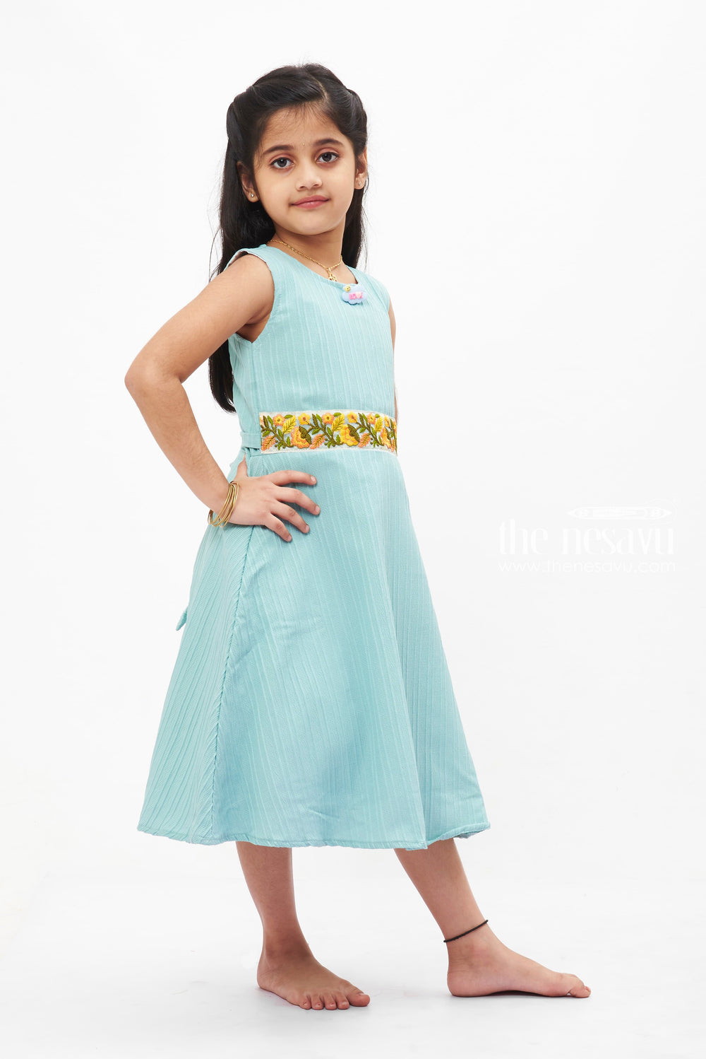 The Nesavu Girls Fancy Frock Blue Dream Pleated Frock: Refreshing Teal with Floral Accent for Girls Nesavu Girls' Teal Pleated Summer Dress | Sleeveless Floral Accent Frock | The Nesavu