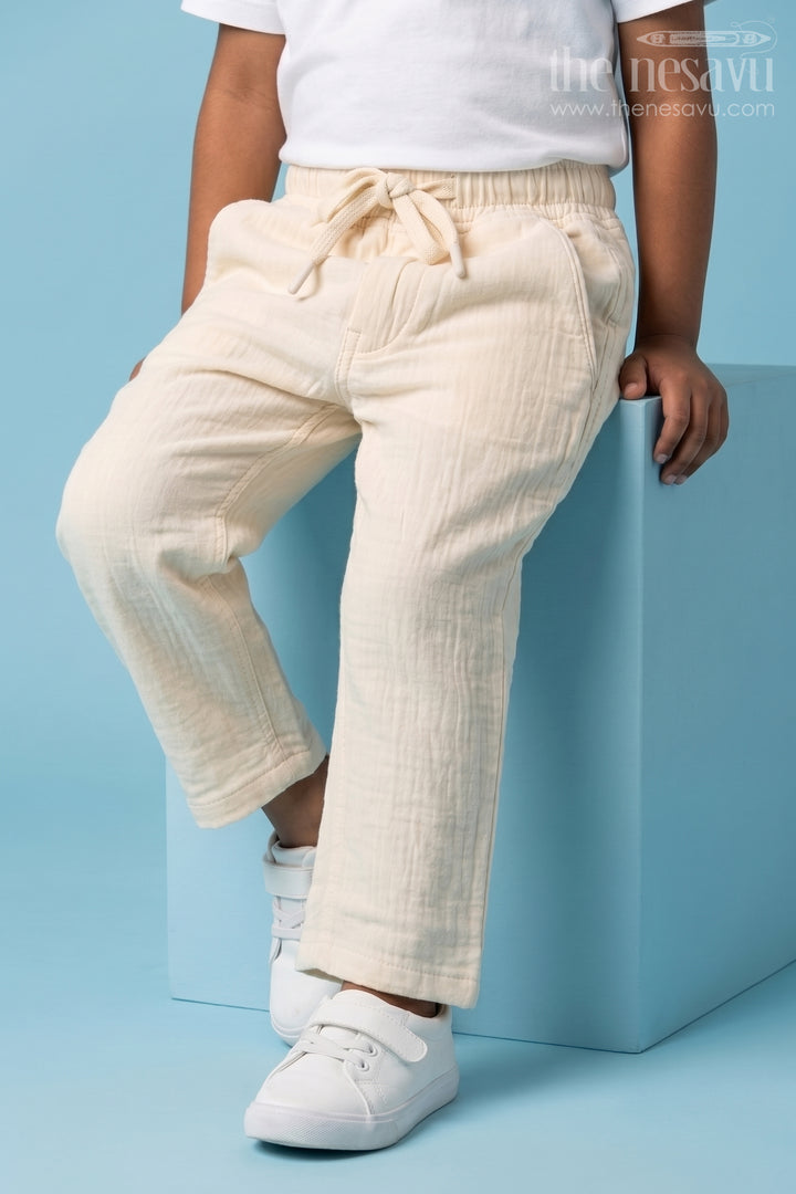 The Nesavu Boys Pant Boys Muslin Cotton Pants for Summer Outings and Relaxed Daily Wear Nesavu 16 (1Y) / Beige / Muslin Cotton BWP031E-16 Nesavu boys muslin cotton pants for summer outings breathable kids casual drawstring pants