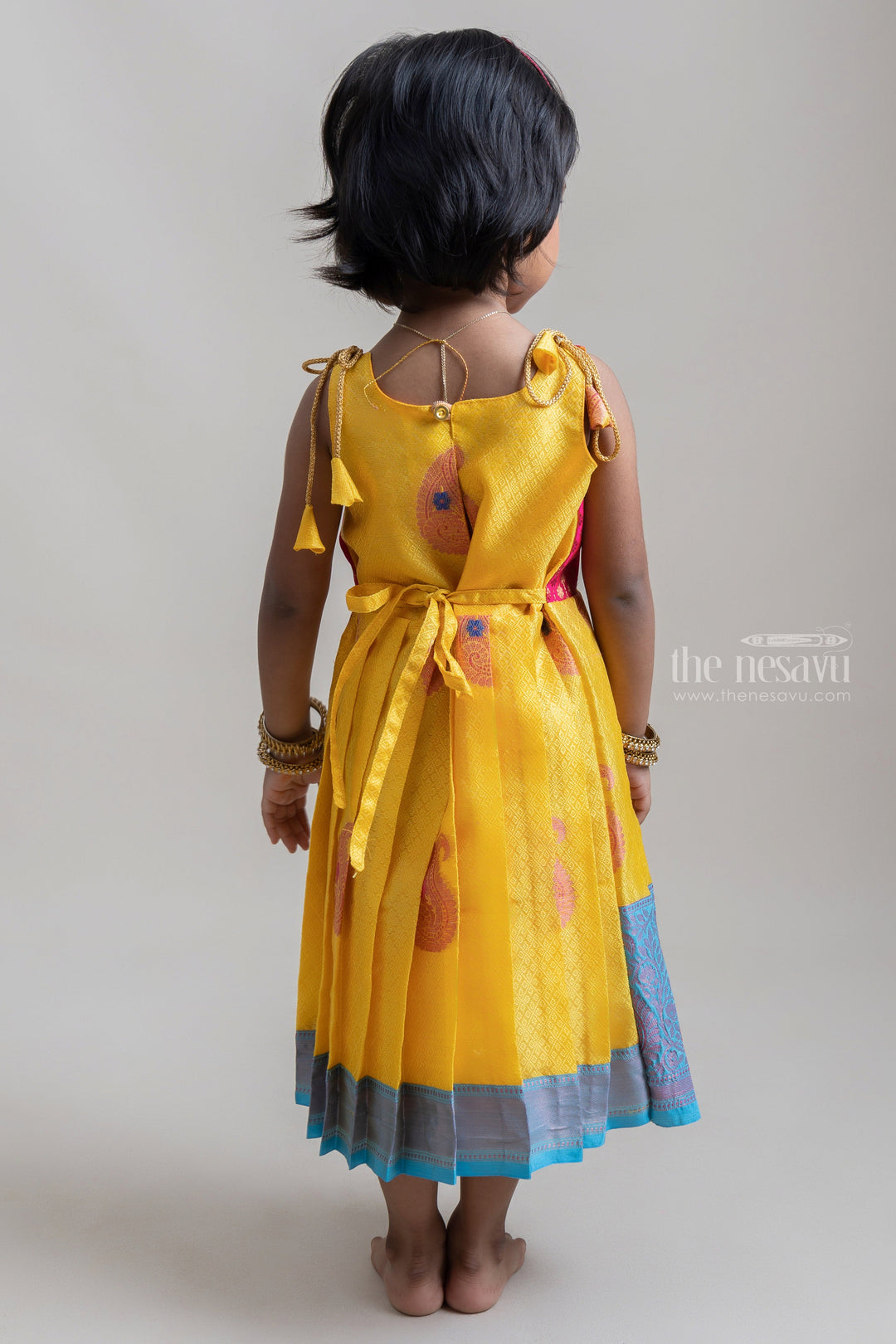 The Nesavu Tie-up Frock Brocade Printed Pink Yoke With Yellow Banaras Silk Tie-Up Frocks For Girls Nesavu Banaras Silk Tie-Up Frocks Collection| Traditional Dresses| The Nesavu