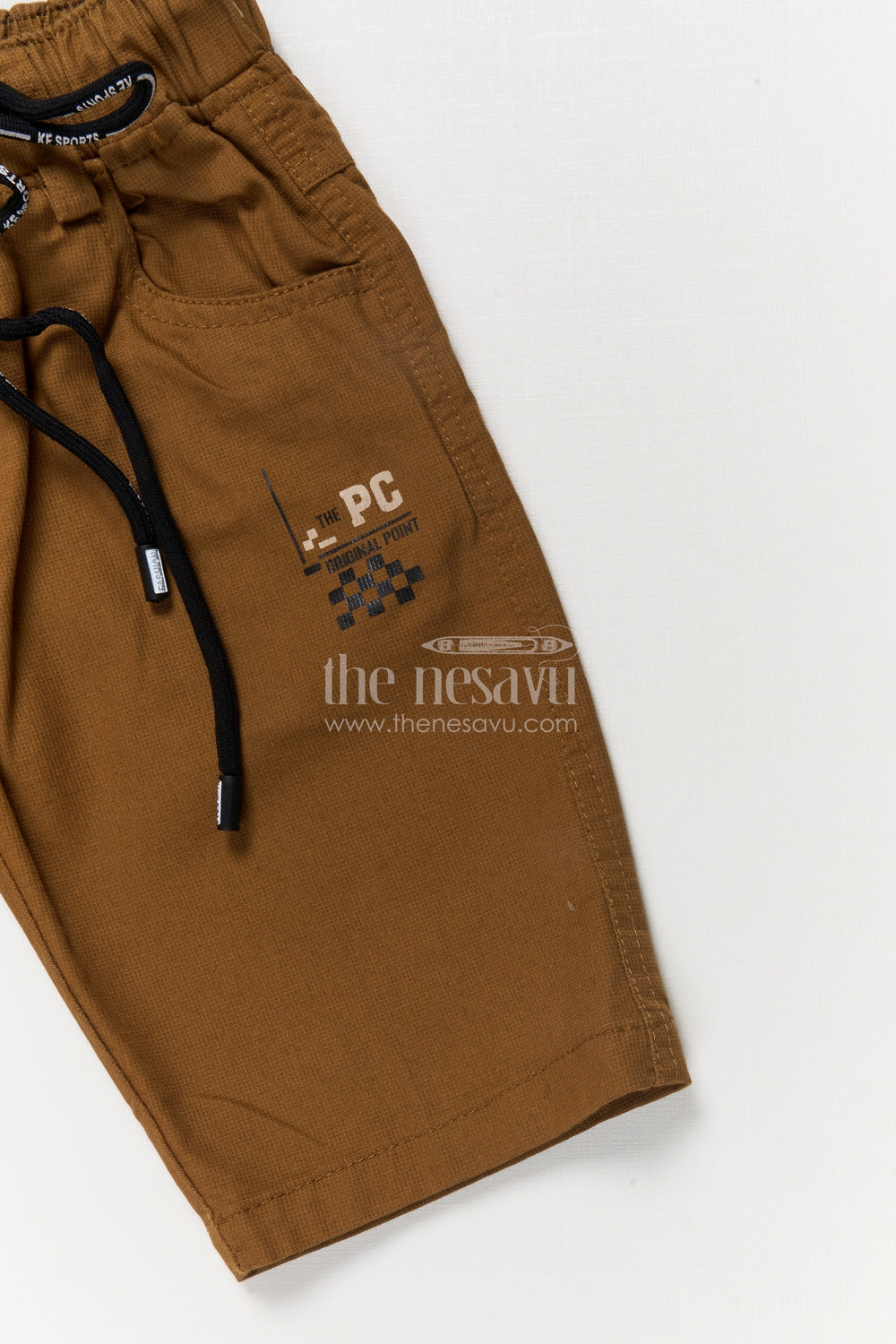 The Nesavu Boys Shorts Casual Boys Cotton Shorts with Sporty Badge and Drawstring Waist Nesavu Boys cotton shorts with checkered flag graphic and sporty print