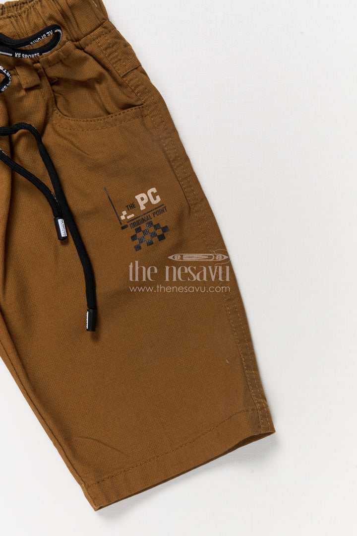 The Nesavu Boys Shorts Casual Boys Cotton Shorts with Sporty Badge and Drawstring Waist Nesavu Boys cotton shorts with checkered flag graphic and sporty print