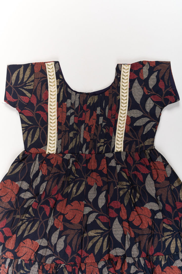 The Nesavu Girls Cotton Frock Charming Black Cotton Party Frock for Girls with Elegant Leaf Print and Frill Hem Nesavu Nesavu Charming Black Cotton Party Frock Girls Elegant Leaf Print Frill Hem