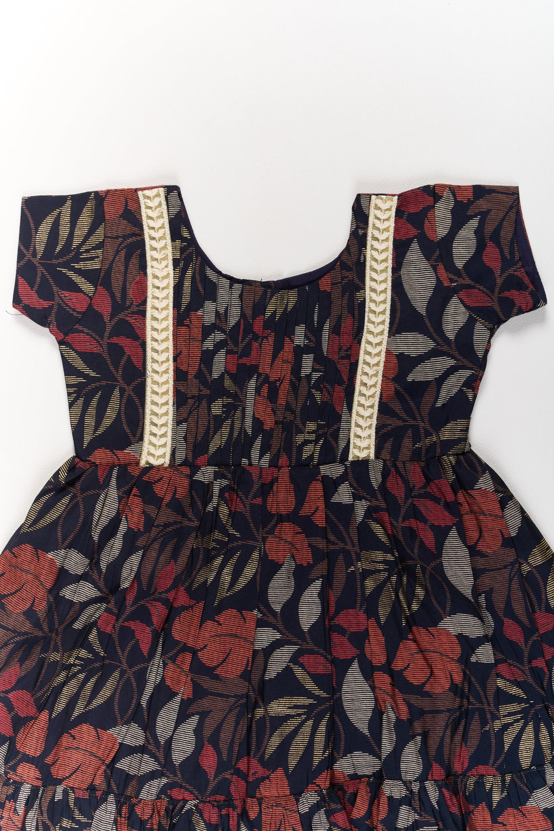 The Nesavu Girls Cotton Frock Charming Black Cotton Party Frock for Girls with Elegant Leaf Print and Frill Hem Nesavu Nesavu Charming Black Cotton Party Frock Girls Elegant Leaf Print Frill Hem