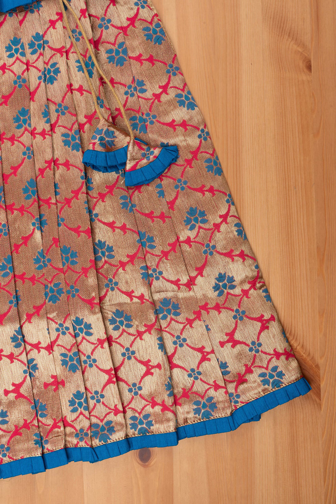 The Nesavu Pattu Pavadai Charming Blue Silk Peplum Blouse with Zari Floral Pattu Pavadai: Perfect Celebration Wear for Girls Nesavu Silk Blouse with Zari Floral Pattu Pavadai | Traditional Pattu Pavadai | The Nesavu