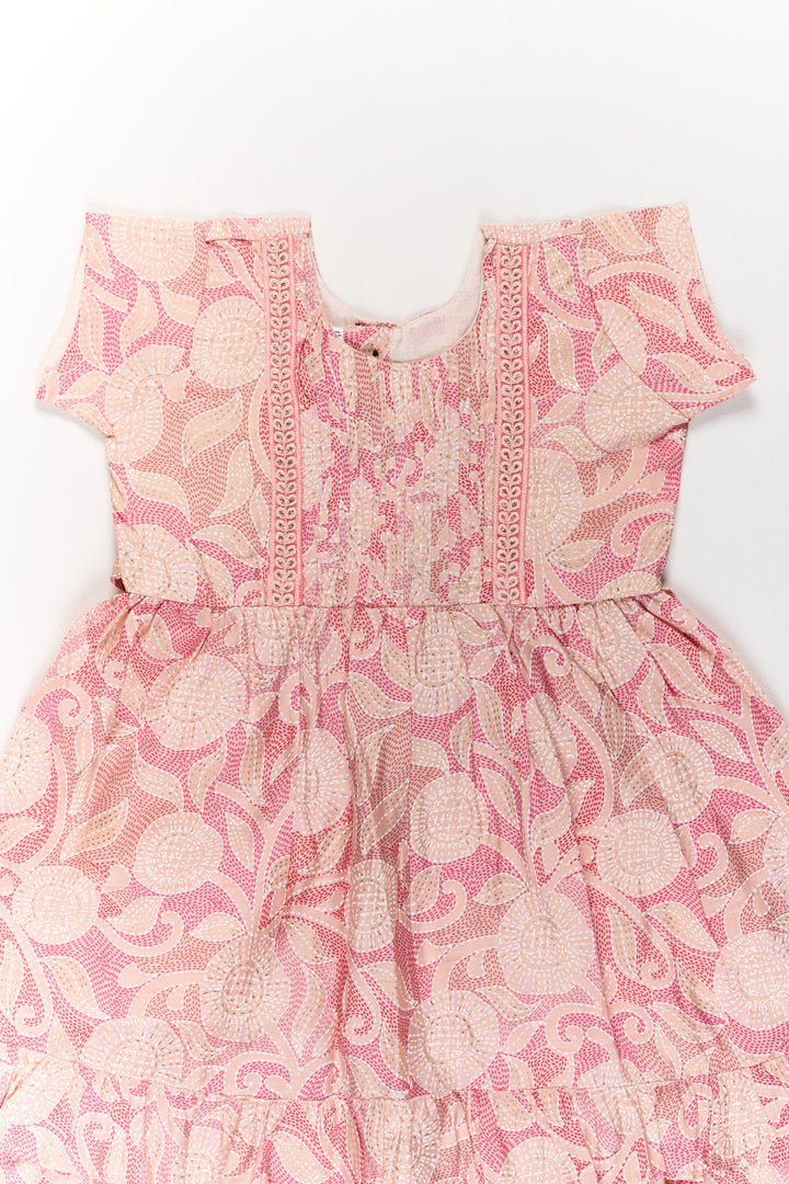 The Nesavu Girls Cotton Frock Charming Pink Cotton Girls Frock with Floral Patterns and Ruffled Sleeves for Everyday Wear Nesavu Nesavu Charming Pink Cotton Girls Frock Floral Patterns Ruffled Sleeves Everyday Wear
