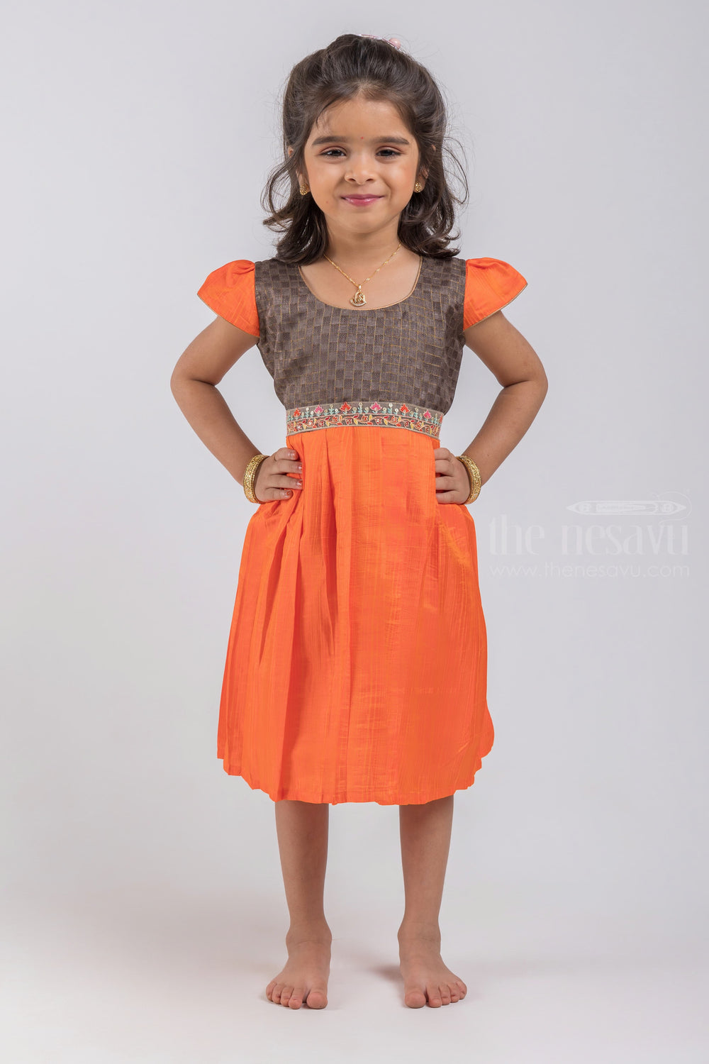 The Nesavu Silk Embroidered Frock Checked Pattern Black Yoke and Knife Pleated Orange Silk Frock for Girls psr silks Nesavu